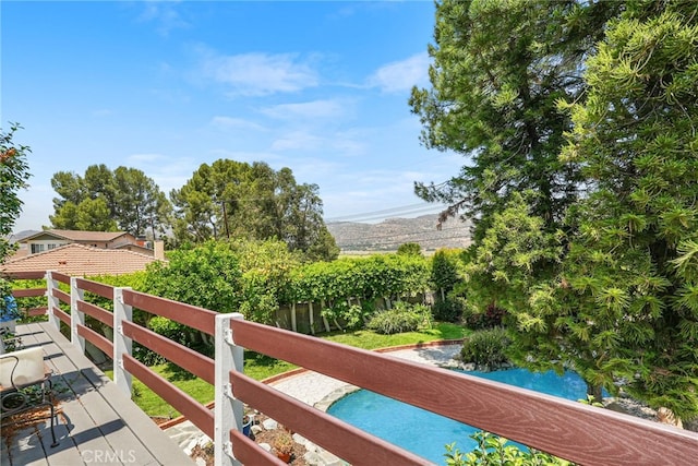 8601 Rudnick Ave, West Hills, CA 91304 - view of wooden balcony with a wooden deck