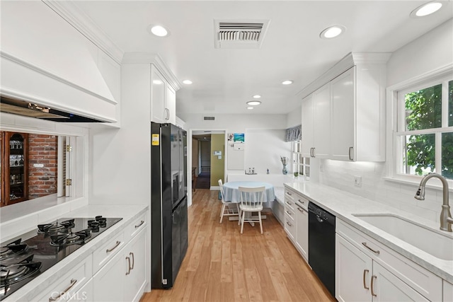 8601 Rudnick Ave, West Hills, CA 91304 - kitchen featuring black appliances, ventilation hood, white cabinetry, tasteful backsplash, and recessed lighting