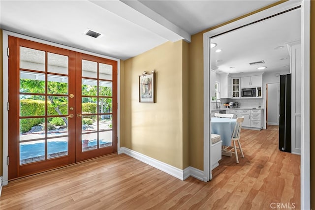 8601 Rudnick Ave, West Hills, CA 91304 - doorway to outside with french doors, light wood finished floors, and recessed lighting