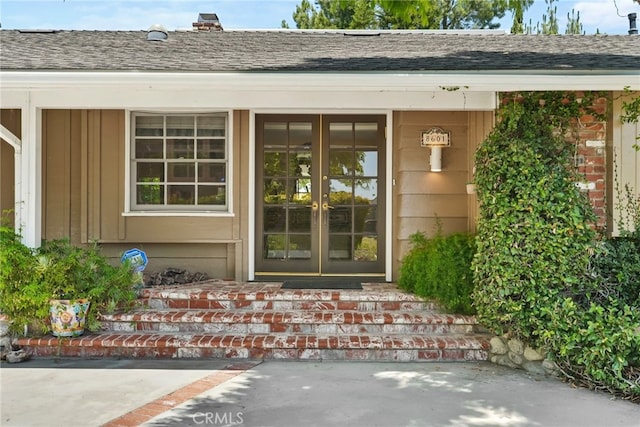 8601 Rudnick Ave, West Hills, CA 91304 - doorway to property with french doors, roof with shingles, and a porch