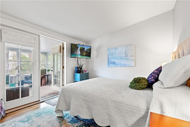 14091 Dall Ln, Tustin, CA 92780 - bedroom with access to exterior, wood finished floors, and lofted ceiling