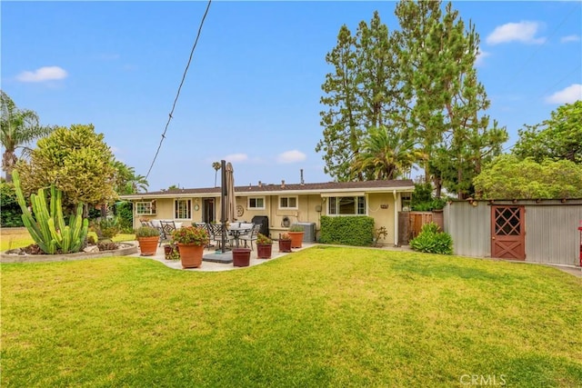 14091 Dall Ln, Tustin, CA 92780 - back of house with a patio area and an outbuilding