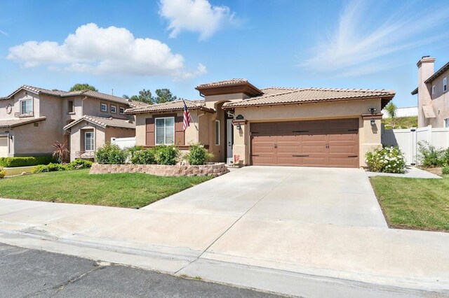 46076 Via Ln, Colorada, Temecula, CA 92592 - mediterranean / spanish home featuring stucco siding, an attached garage, a tiled roof, and driveway