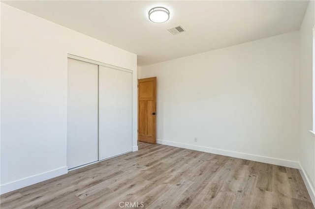 38876 Foxholm Dr, Palmdale, CA 93551 - unfurnished bedroom with light wood-style floors and a closet