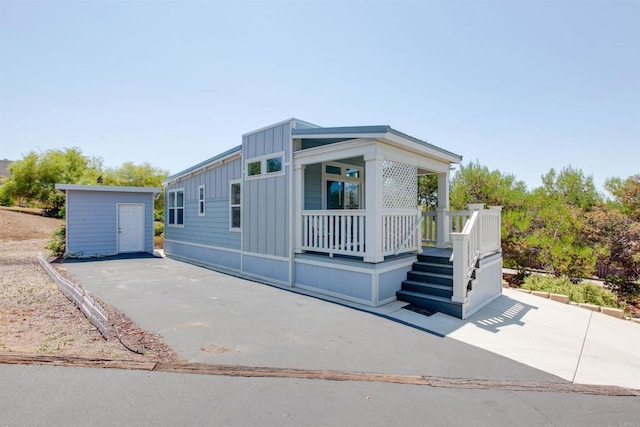 2149 Gamble Pl, Escondido, CA 92029 - manufactured / mobile home featuring board and batten siding and a storage unit
