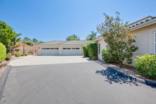2149 Gamble Pl, Escondido, CA 92029 - view of front of house with stucco siding, concrete driveway, a tiled roof, and a garage