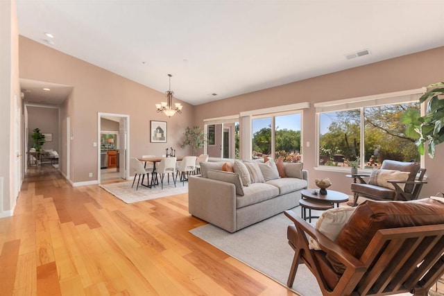 2149 Gamble Pl, Escondido, CA 92029 - living area featuring a chandelier, light wood-style flooring, and lofted ceiling