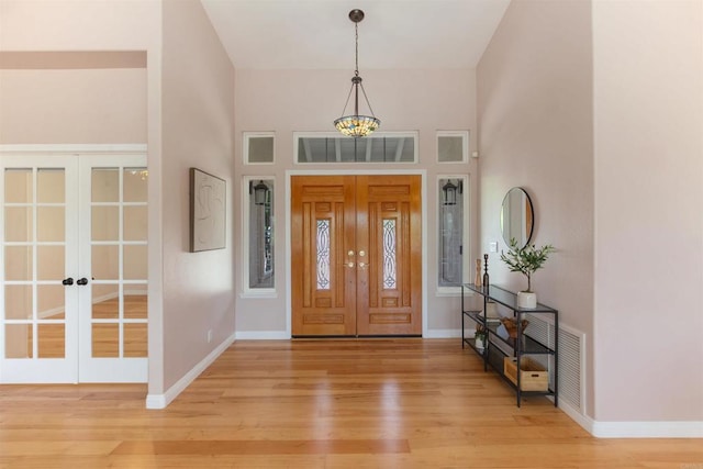 2149 Gamble Pl, Escondido, CA 92029 - foyer with french doors, light wood-style floors, and a towering ceiling