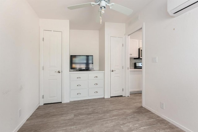 2149 Gamble Pl, Escondido, CA 92029 - unfurnished bedroom featuring a wall mounted AC, wood finished floors, and ceiling fan
