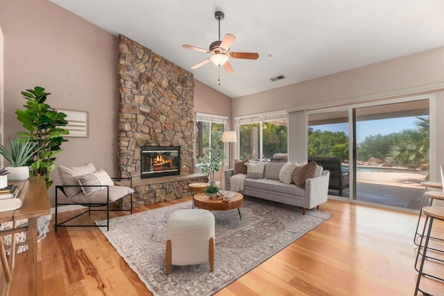 2149 Gamble Pl, Escondido, CA 92029 - living room featuring a ceiling fan, wood finished floors, a fireplace, and high vaulted ceiling