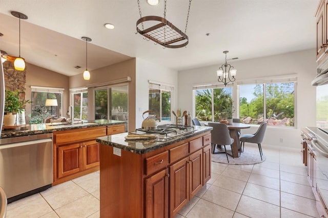 2149 Gamble Pl, Escondido, CA 92029 - kitchen featuring appliances with stainless steel finishes, brown cabinets, light tile patterned flooring, healthy amount of natural light, and recessed lighting