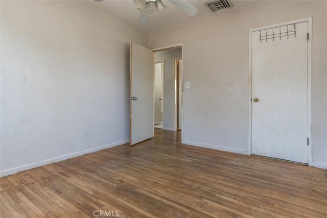15300 Mayall St, San Fernando, CA 91345 - unfurnished bedroom featuring wood finished floors and ceiling fan