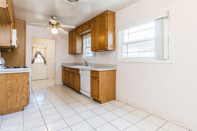 15300 Mayall St, San Fernando, CA 91345 - kitchen featuring white appliances, light countertops, ceiling fan, and brown cabinetry