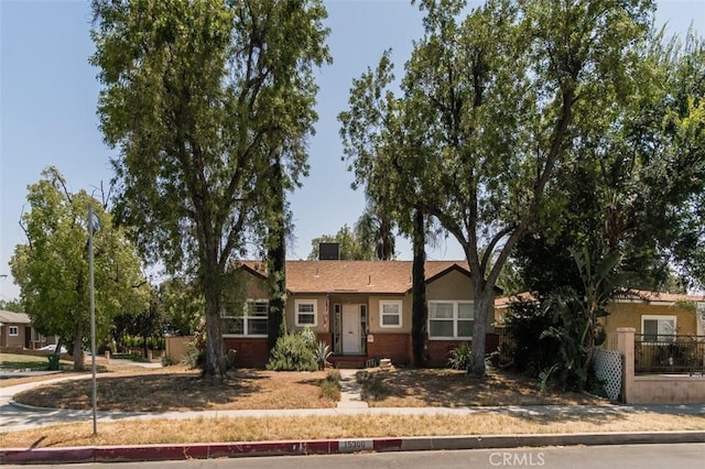 15300 Mayall St, San Fernando, CA 91345 - view of front facade with stucco siding and brick siding