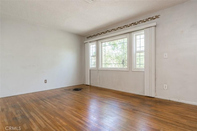 15300 Mayall St, San Fernando, CA 91345 - unfurnished room featuring wood-type flooring and a textured ceiling