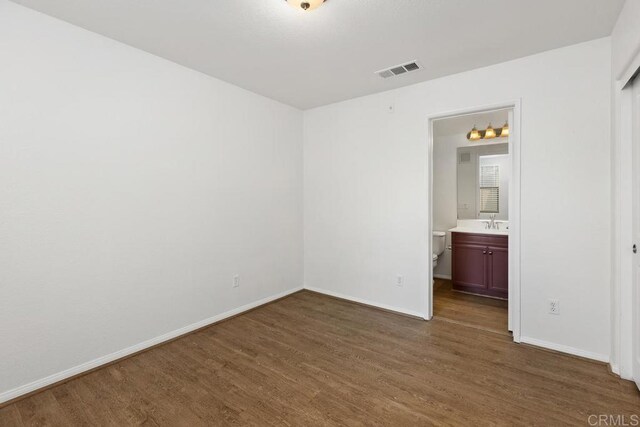 1837 Olive Green St Unit 3, Chula Vista, CA 91913 - unfurnished bedroom with wood finished floors and ensuite bath