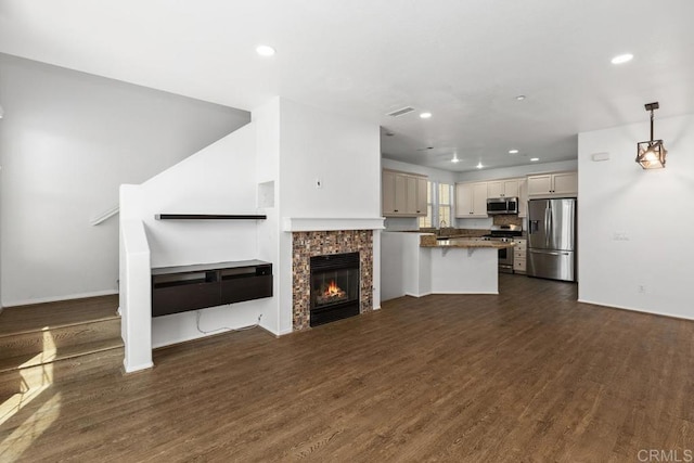 1837 Olive Green St Unit 3, Chula Vista, CA 91913 - unfurnished living room with dark wood-type flooring, recessed lighting, and a fireplace