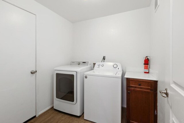 1837 Olive Green St Unit 3, Chula Vista, CA 91913 - laundry area with independent washer and dryer, light wood-style floors, and cabinet space