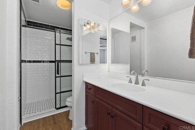 1837 Olive Green St Unit 3, Chula Vista, CA 91913 - bathroom featuring a stall shower, vanity, and wood finished floors