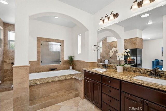289 23rd St, Costa Mesa, CA 92627 - bathroom featuring double vanity, a garden tub, walk in shower, tile patterned floors, and recessed lighting
