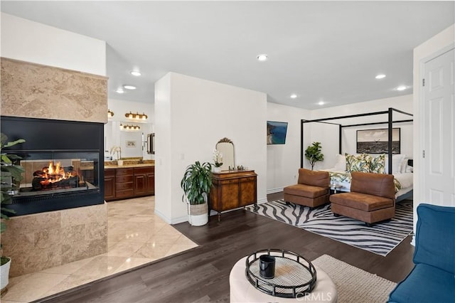 289 23rd St, Costa Mesa, CA 92627 - living room with wood finished floors, a multi sided fireplace, and recessed lighting