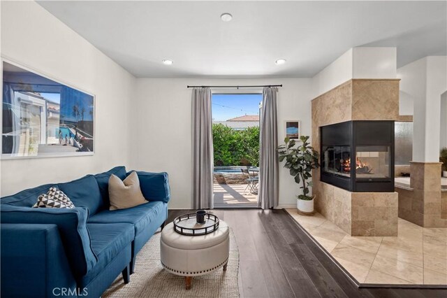 289 23rd St, Costa Mesa, CA 92627 - living room featuring wood finished floors, recessed lighting, and a fireplace
