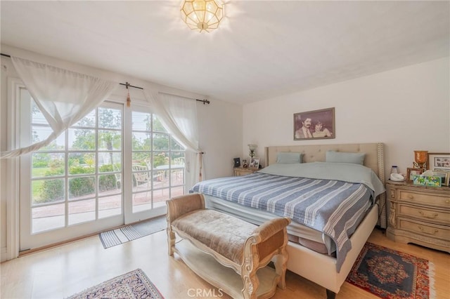 26767 Shadow Wood Dr, Rancho Palos Verdes, CA 90275 - bedroom with multiple windows, access to exterior, and wood finished floors