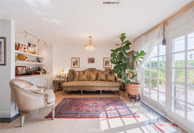 26767 Shadow Wood Dr, Rancho Palos Verdes, CA 90275 - tiled living area featuring healthy amount of natural light and a chandelier