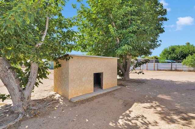 10723 Portland Ave, Hesperia, CA 92345 - view of side of home featuring stucco siding