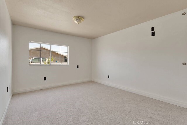10723 Portland Ave, Hesperia, CA 92345 - spare room with carpet flooring and baseboards