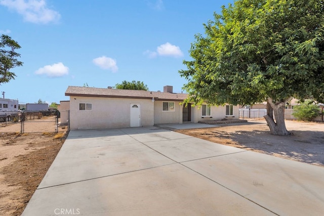 10723 Portland Ave, Hesperia, CA 92345 - ranch-style house with concrete driveway, a patio, and stucco siding