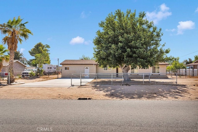 10723 Portland Ave, Hesperia, CA 92345 - view of front of property with a gate, a fenced front yard, and concrete driveway