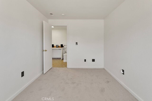 10723 Portland Ave, Hesperia, CA 92345 - spare room featuring light colored carpet and baseboards