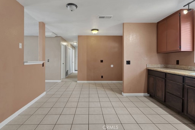 10723 Portland Ave, Hesperia, CA 92345 - kitchen with light countertops and light tile patterned flooring