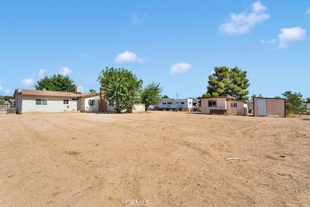10723 Portland Ave, Hesperia, CA 92345 - view of yard with a shed