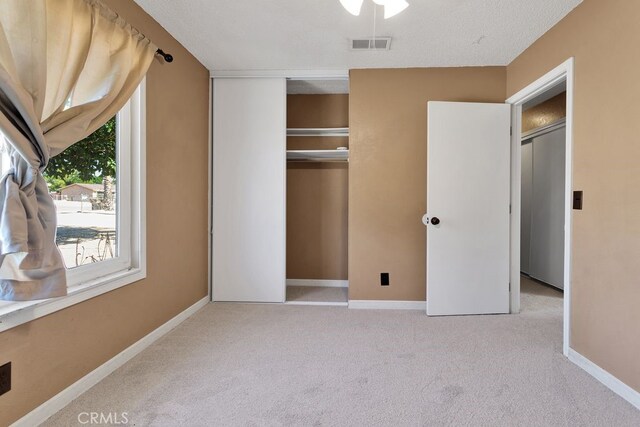 10723 Portland Ave, Hesperia, CA 92345 - unfurnished bedroom featuring carpet flooring and a closet