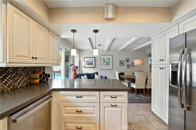 11832 Weatherby Rd, Los Alamitos, CA 90720 - kitchen featuring stainless steel appliances, a peninsula, dark countertops, decorative backsplash, and beam ceiling