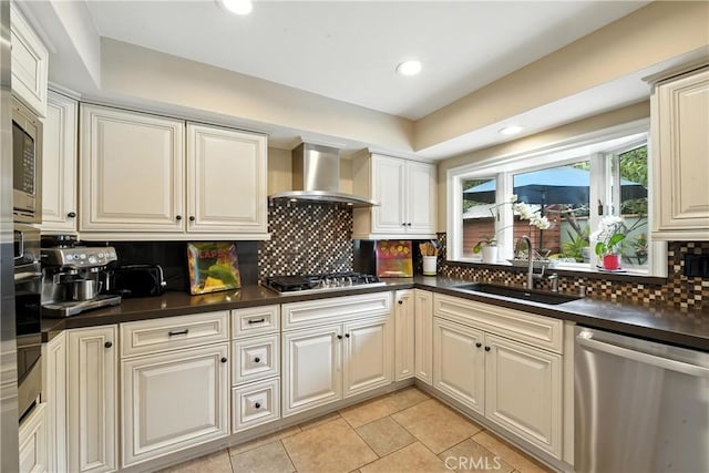 11832 Weatherby Rd, Los Alamitos, CA 90720 - kitchen with stainless steel appliances, wall chimney range hood, dark countertops, tasteful backsplash, and recessed lighting