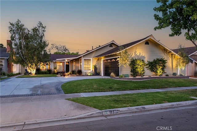 11832 Weatherby Rd, Los Alamitos, CA 90720 - ranch-style house featuring curved driveway, a front lawn, and an attached garage