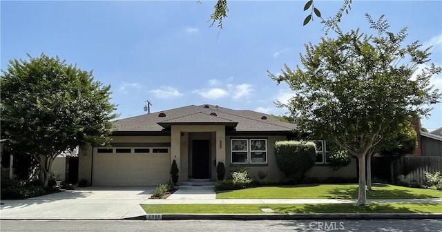 2068 Radnor Ave, Long Beach, CA 90815 - view of front of house featuring a garage, stucco siding, and concrete driveway