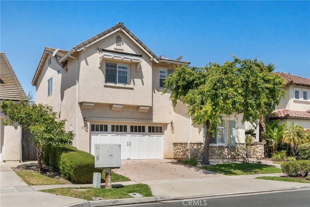 2511 Del Sur, Santa Maria, CA 93455 - traditional-style house featuring an attached garage, concrete driveway, and stucco siding