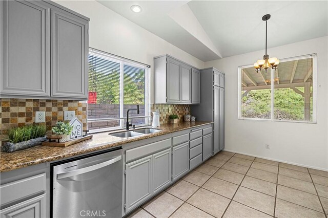 42158 Valley Vista Dr, Lancaster, CA 93536 - kitchen with stainless steel dishwasher, gray cabinetry, lofted ceiling, healthy amount of natural light, and a chandelier