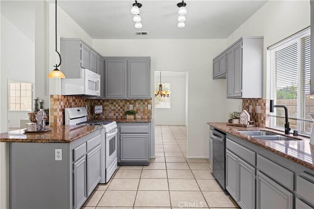 42158 Valley Vista Dr, Lancaster, CA 93536 - kitchen with white appliances, gray cabinets, and light tile patterned flooring