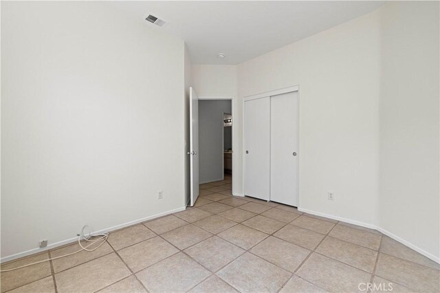 42158 Valley Vista Dr, Lancaster, CA 93536 - unfurnished bedroom featuring a closet and light tile patterned floors
