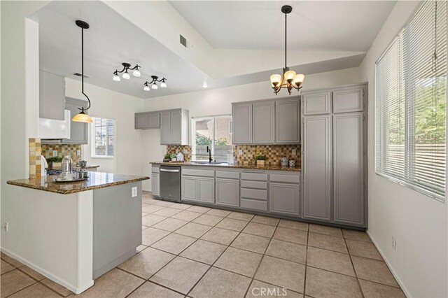 42158 Valley Vista Dr, Lancaster, CA 93536 - kitchen with gray cabinets, dishwasher, tasteful backsplash, light tile patterned floors, and dark stone counters