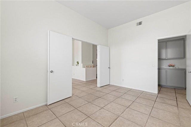 42158 Valley Vista Dr, Lancaster, CA 93536 - empty room with light tile patterned flooring and baseboards