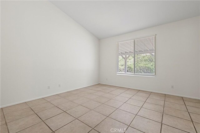 42158 Valley Vista Dr, Lancaster, CA 93536 - unfurnished room featuring vaulted ceiling and light tile patterned floors