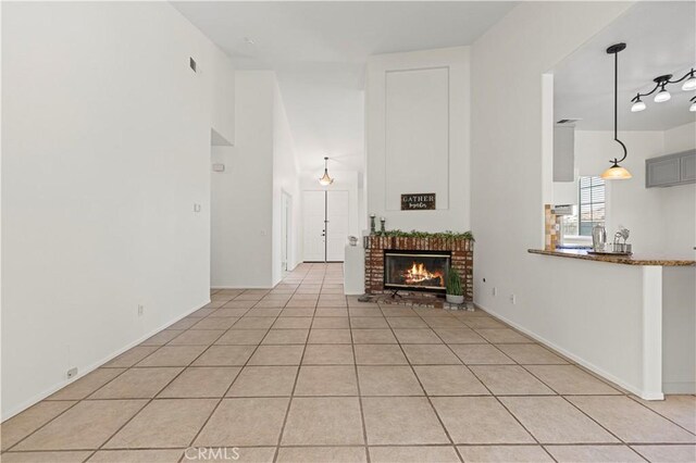 42158 Valley Vista Dr, Lancaster, CA 93536 - living area with a fireplace and light tile patterned floors