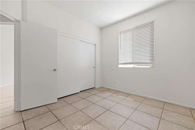 42158 Valley Vista Dr, Lancaster, CA 93536 - unfurnished bedroom featuring a closet and light tile patterned floors