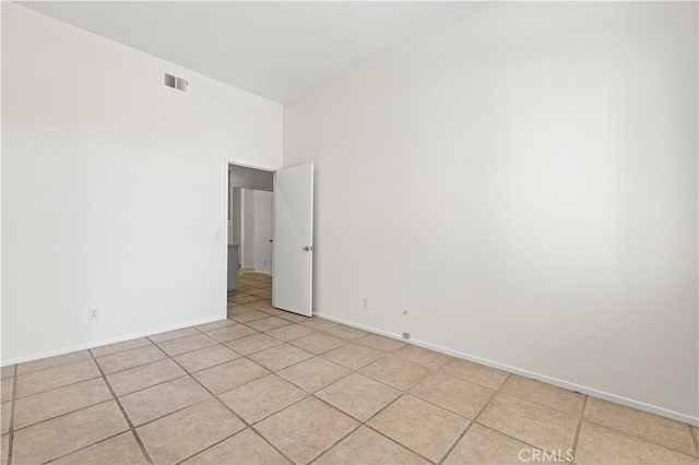 42158 Valley Vista Dr, Lancaster, CA 93536 - empty room featuring light tile patterned floors and a high ceiling